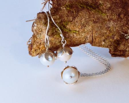 pearl drop earrings and a pearl pendant