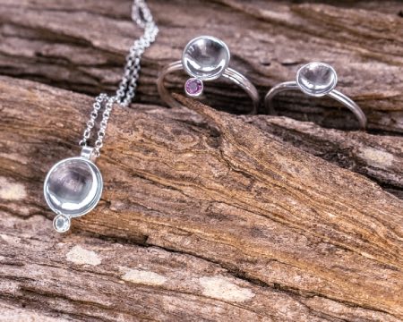 necklace and rings with in silver with a half circle design